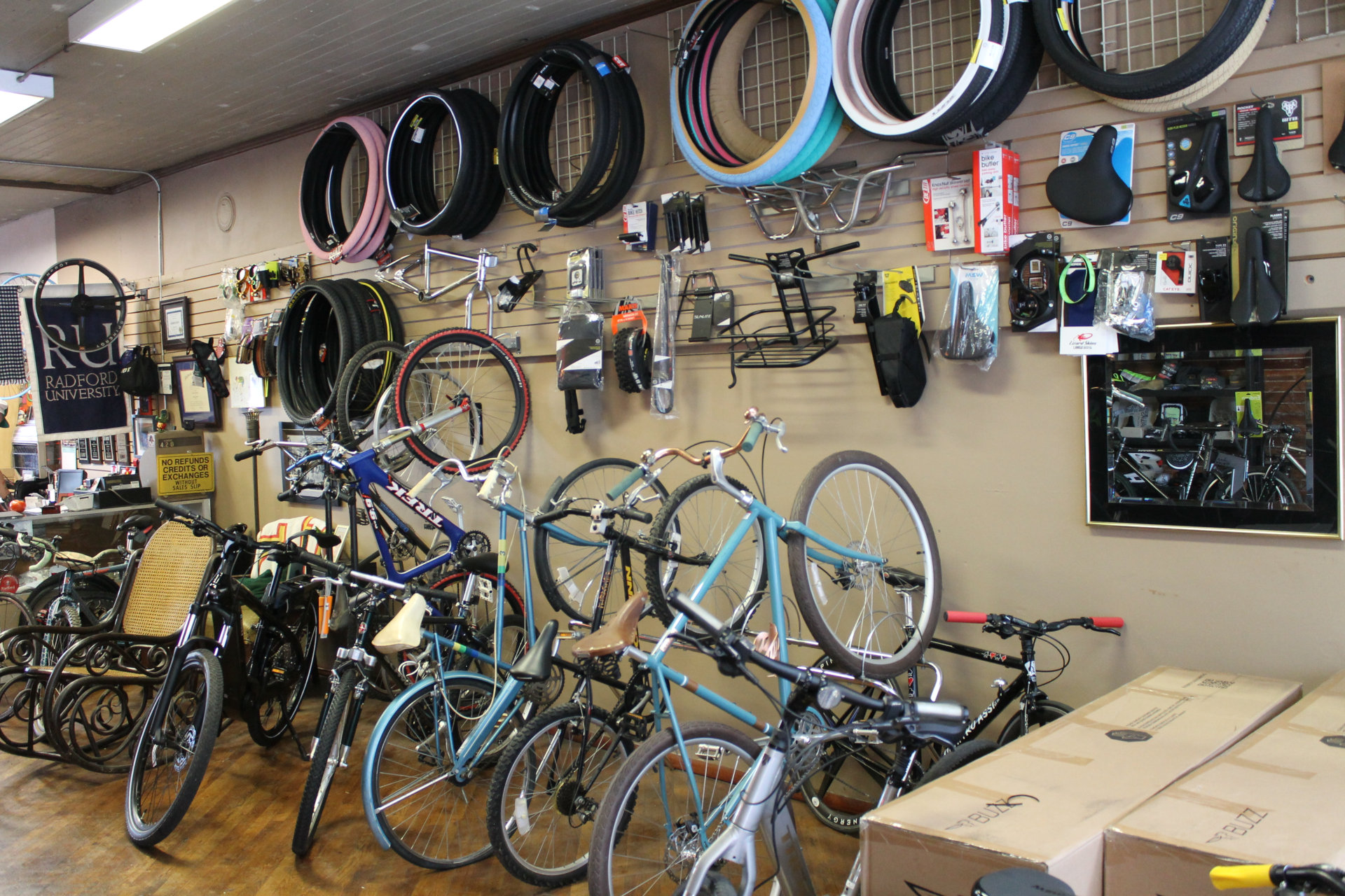 Tires, seats, and accessories covering an entire wall at Hund's